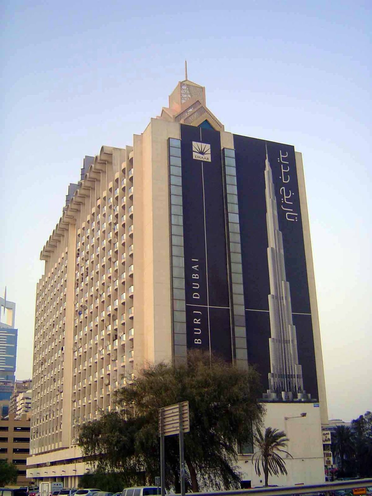 Heads up. The Burj Dubai advertises on the Sheikh Rashid apartment building. Tut, tut; tarnishing the brand by associating with a building t