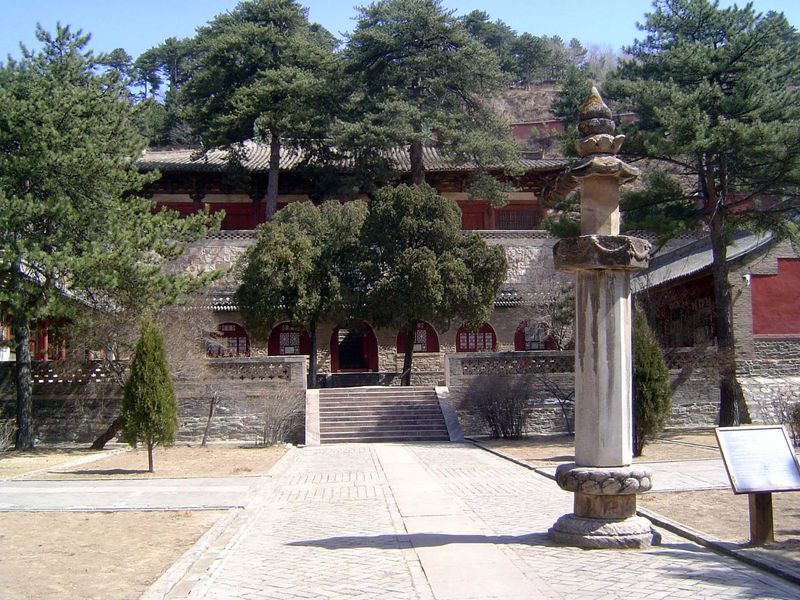 We step in the gate and are in a courtyard. There's a fine old building to our left, while Foguang sits straight ahead, on a terrace cut int