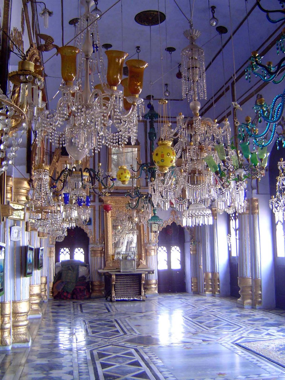 Entrance hall, with a riot of chandeliers.