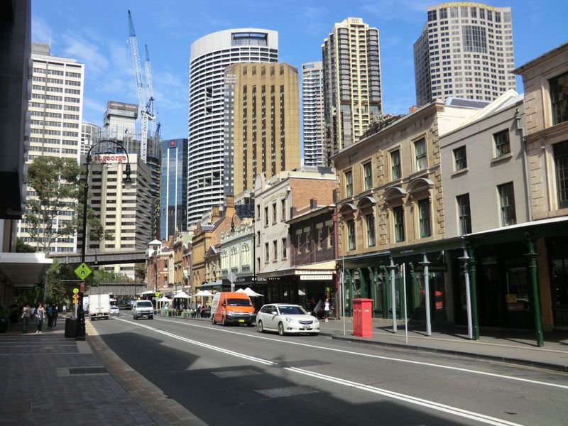 Here on George Street there's a juxtaposition of old and new. The old survives mostly as part of The Rocks, a tourist center, but it says so