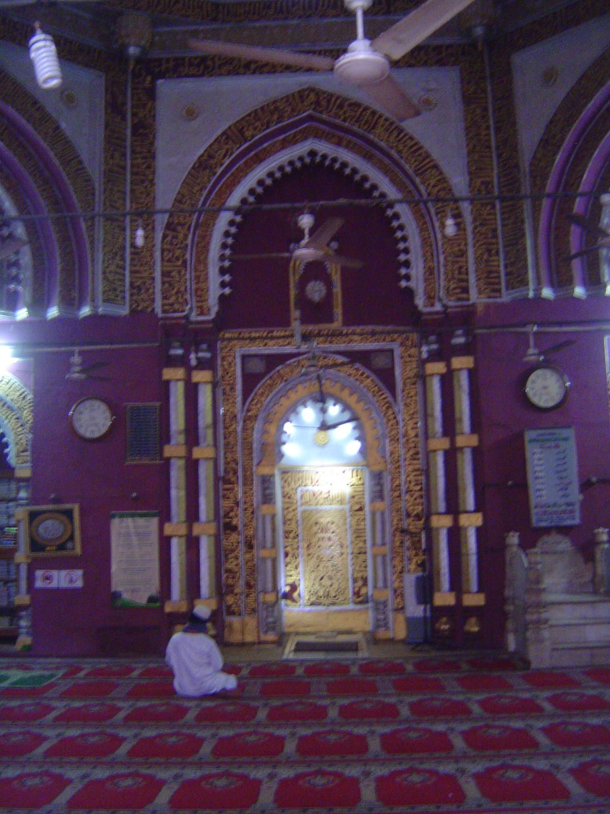 The interior, trimmed with Quranic quotations.