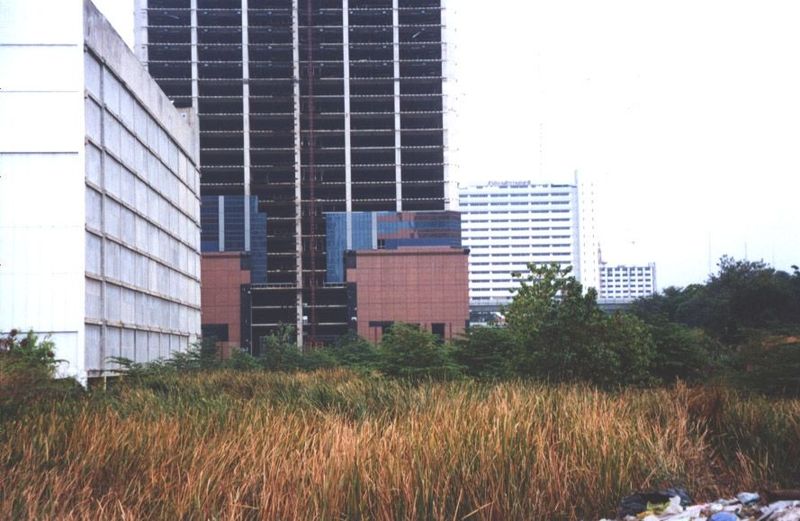 The dump is also the backyard of the World Trade Center, a shopping center that's open but limping from the bruising competition.