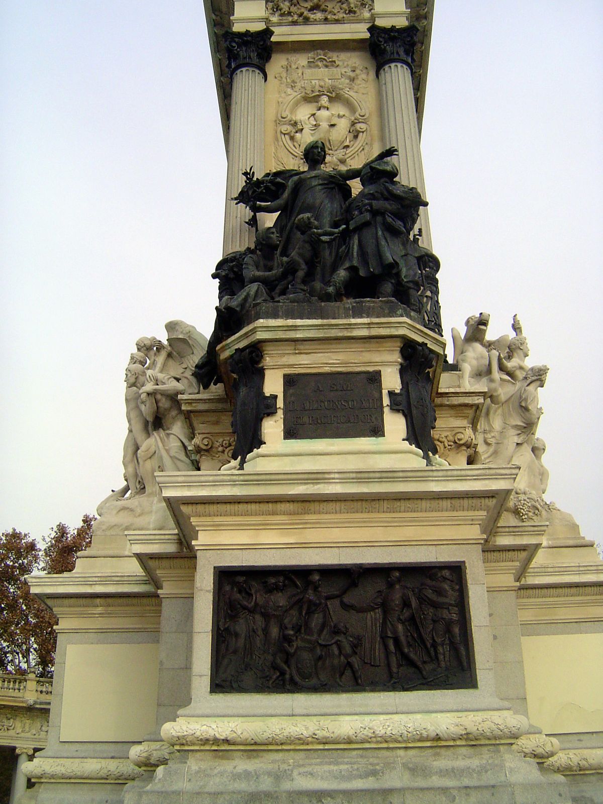 Figures of Peace, Freedom, and Progress rim the pedestal of the equestrian statue. Peace is shown here, in bronze. Freedom is on the left.