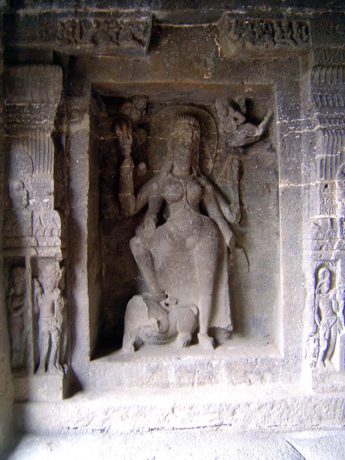 Durga, foot on lion and trident in hand.