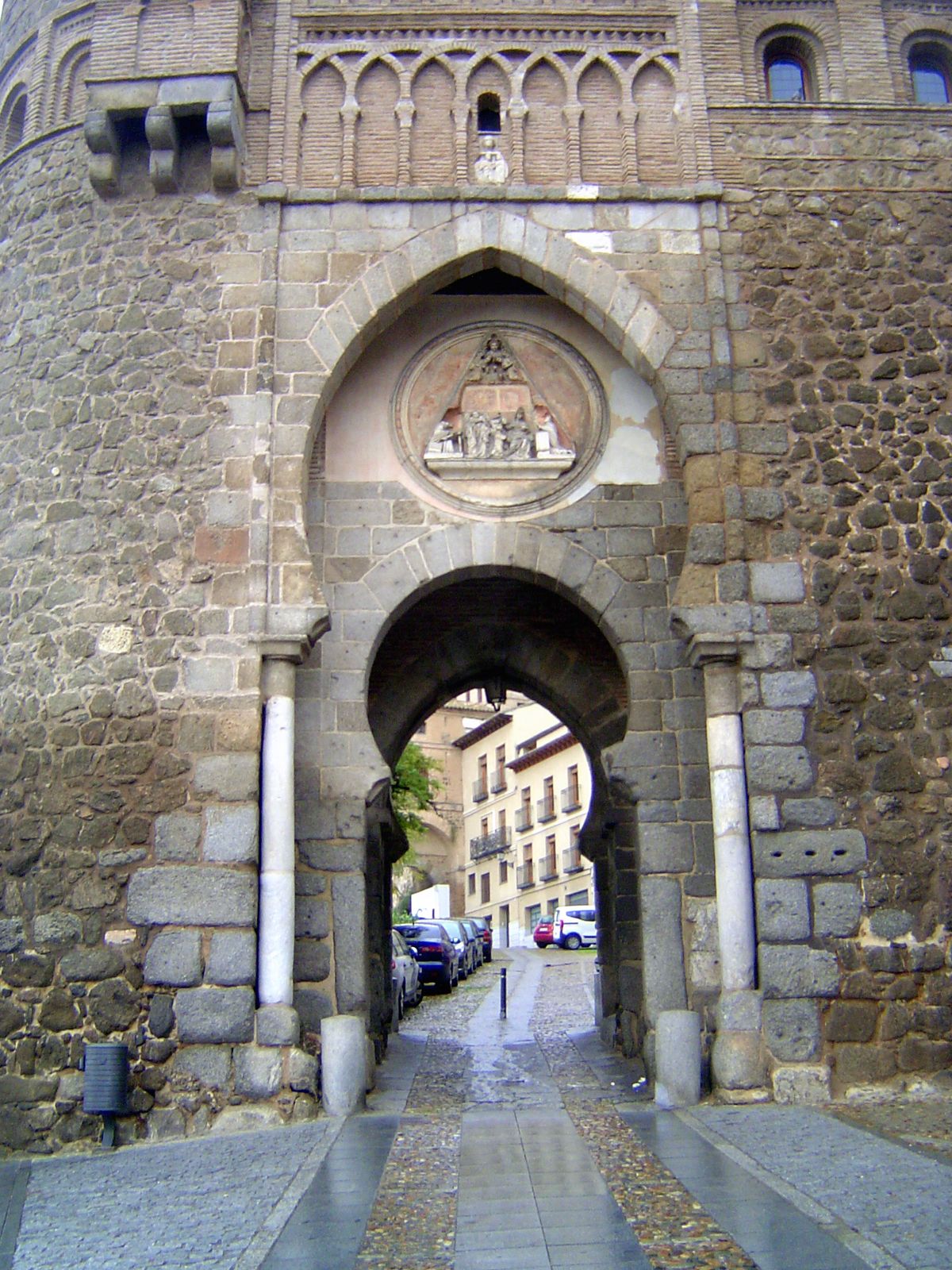 Close-up. The gate was built before 1400 by the Knights of St. John of Jerusalem, who adopted the architectural forms of Muslim Spain. Until