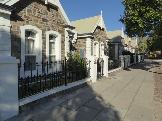 If the housing around Wellington Square—one of six in the park-wrapped city—seems an exercise in Victorian domesticity, remember the British
