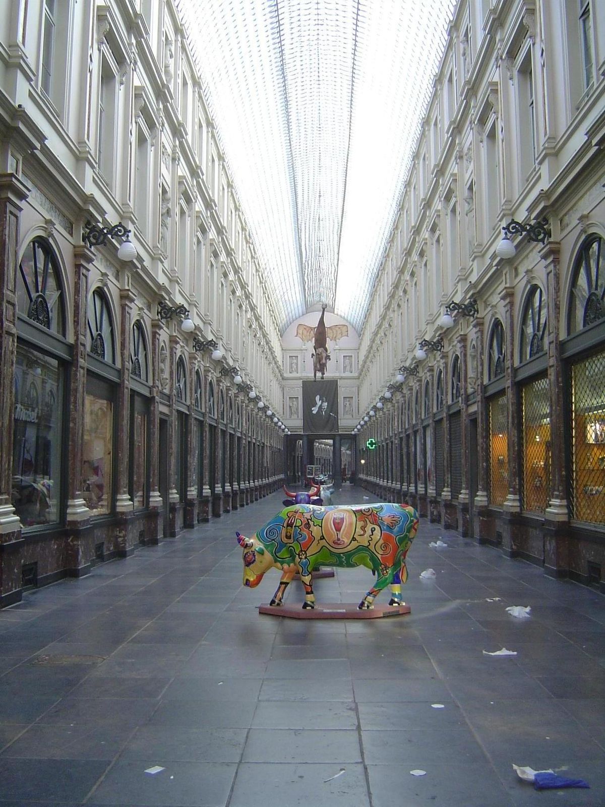 What do the bourgeois do? Shop, of course. Here's a proto-mall near the Grand Place. It's the Galeries Hubert, built in 1847 and 234 yards l