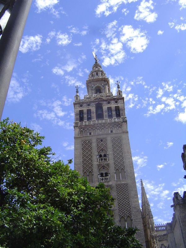 The Giralda Tower, now a cathedral bell tower, was built as a minaret. Date: 1184-96. Unlike the cathedral in Cordoba, which rises in the mi