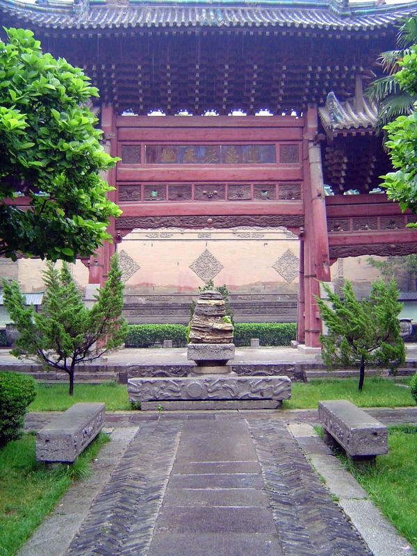 The view back through the gate to a screen wall. Normally, such a screen wall would block the view from the street beyond, but in this case 