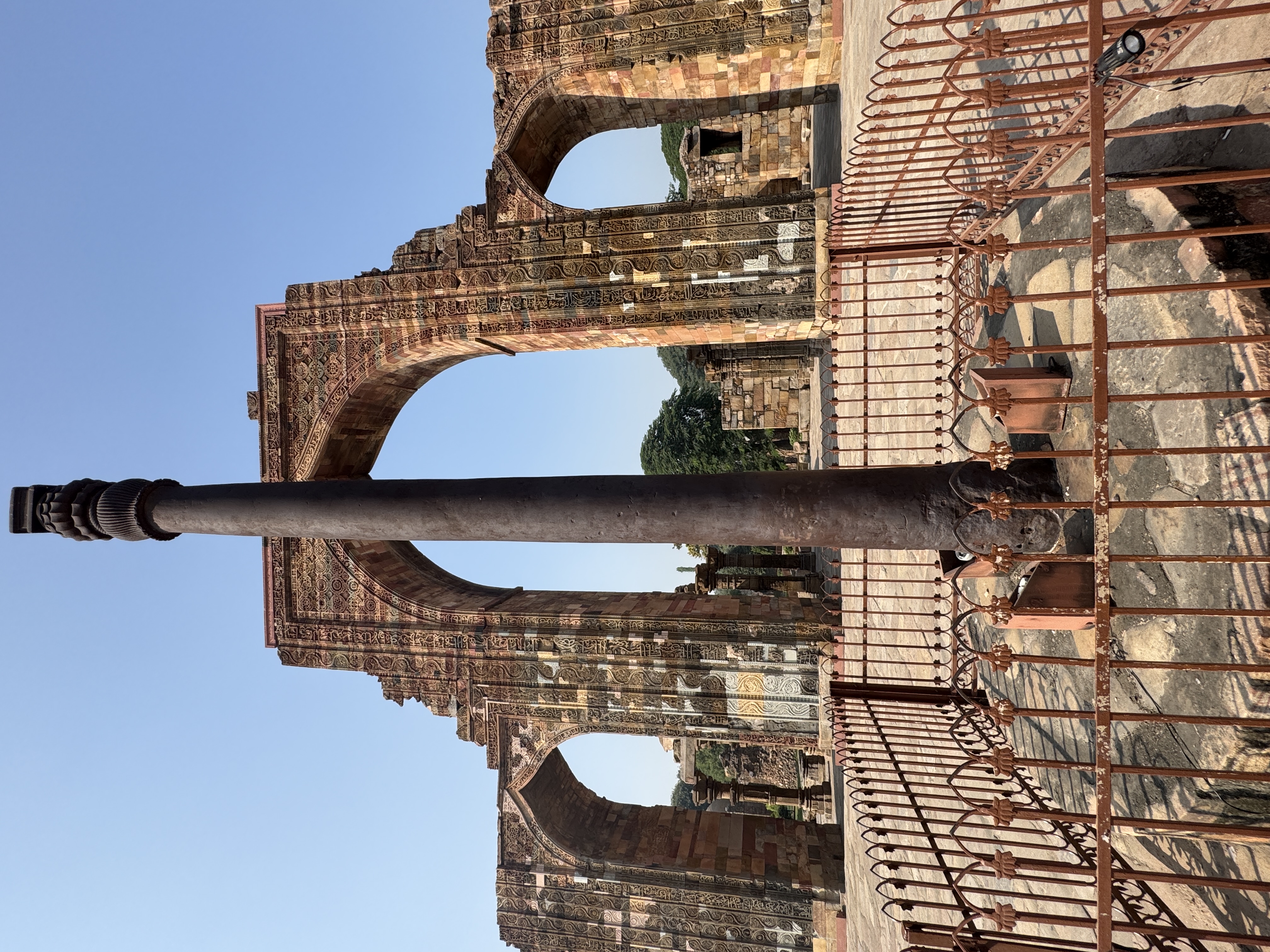 The famous iron pillar dates from a 4th century Hindu kingdom, where it probably belonged to a Vishnu temple.  It is almost always described