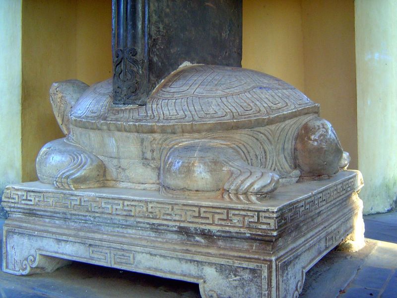 A stele nearby was installed in 1716; the tortoise base suggests permanence.