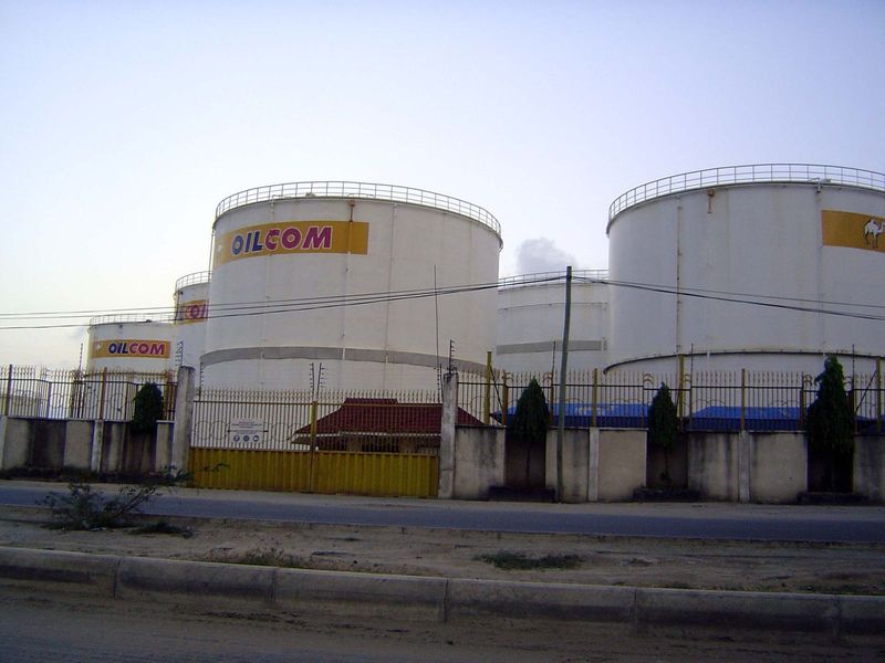 The answer was the owner of "Oil Com," whose tanks are a few miles away on the harbor.