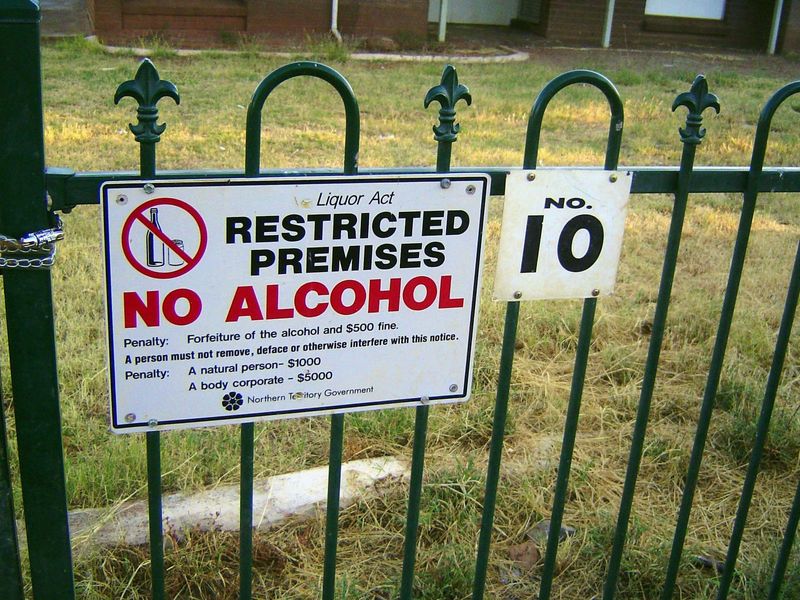 Bureaucracy! The fine for spoiling the sign is bigger than the fine for violating the sign's injunction.