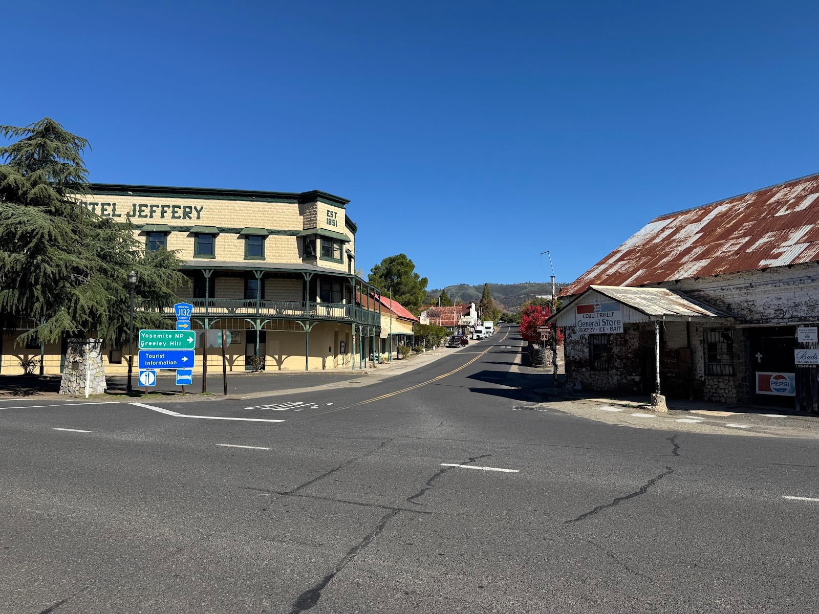 Highway 49 meets Greeley Hill Road, Coulterville's main street.  It would be odd if the name didn't come from Horace.  The hotel lacks the i