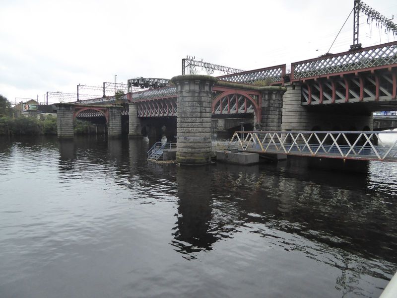 So we're back to the river and between the two pedestrian bridges where we started. In front of us are two bridges built for the Caledonian 
