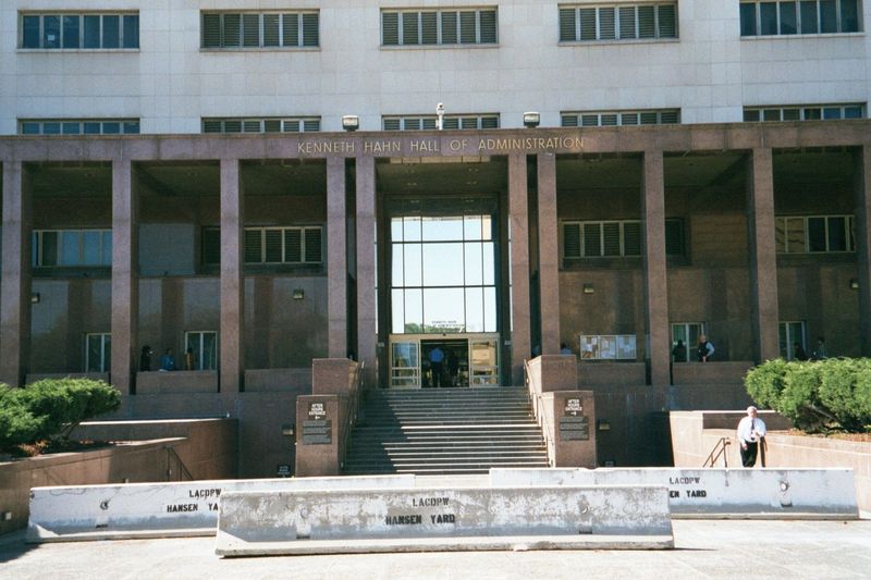 Meanwhile, public buildings are transformed. This one was completed in 1960. In 2002, when this picture was taken, the Jersey Barriers or K-