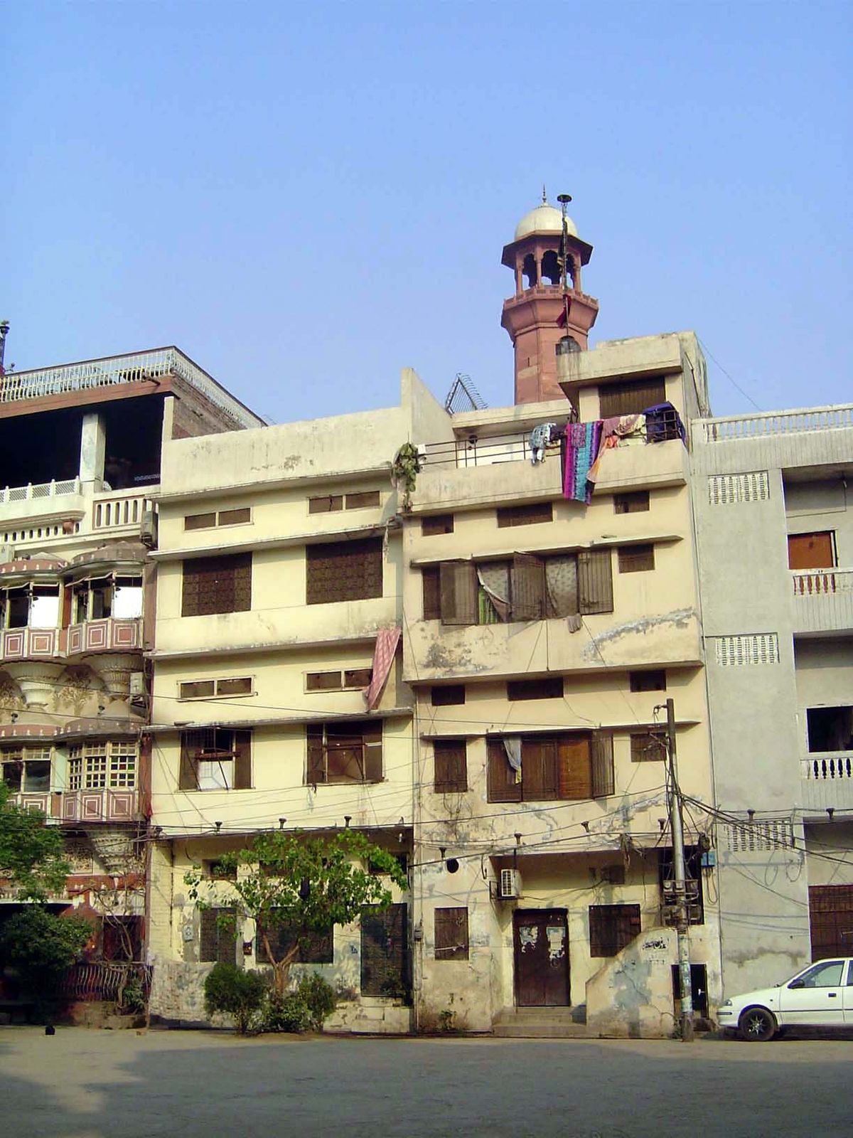 Across the courtyard, new buildings.
