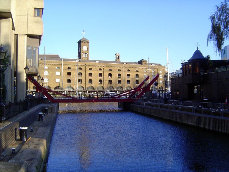 Beyond the bright red second new bridge, the basin is filled with yachts, their masts rising in front of Ivory House, from 1860. It's the on