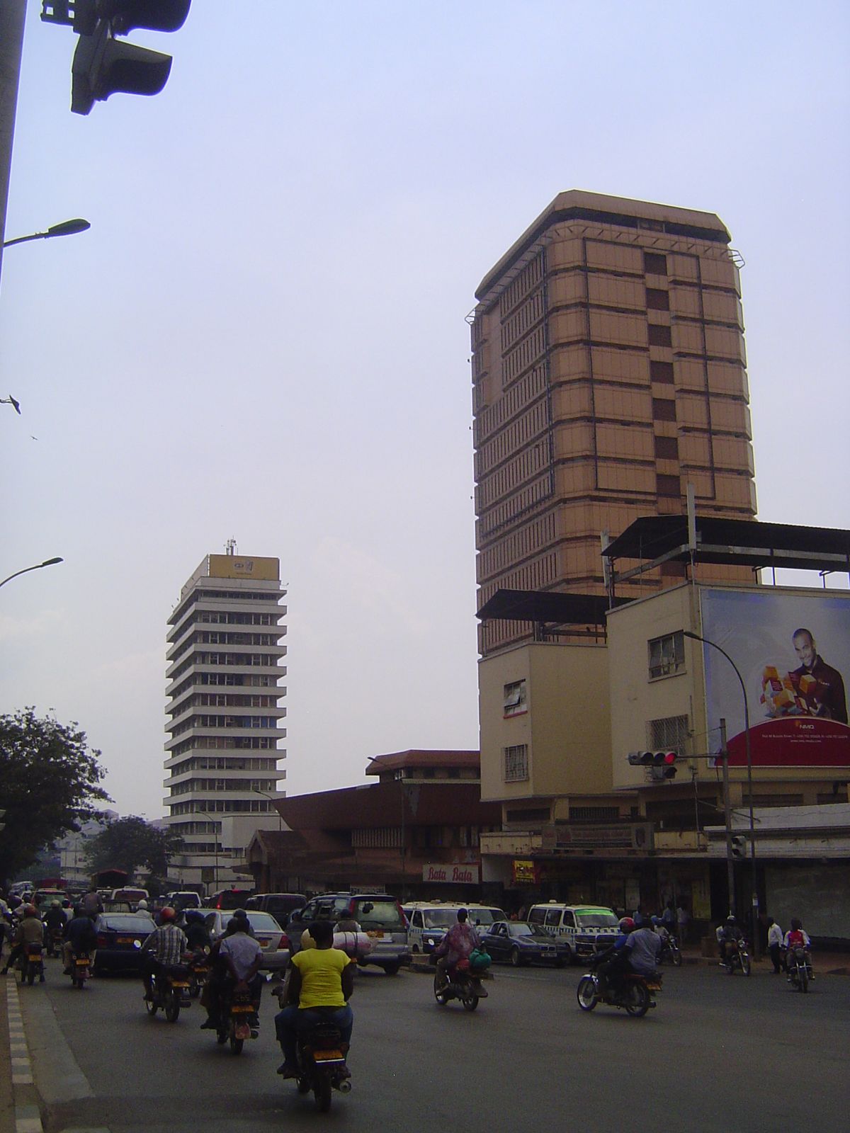That's Uganda House on the left, built in 1980 and housing the Uganda People's Congress. The Cham Towers, on the right, were built in 1979 a
