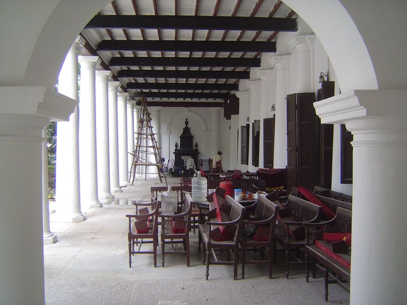 The veranda runs along one side of the prayer hall. The monument in the distance is to a woman benefactor.