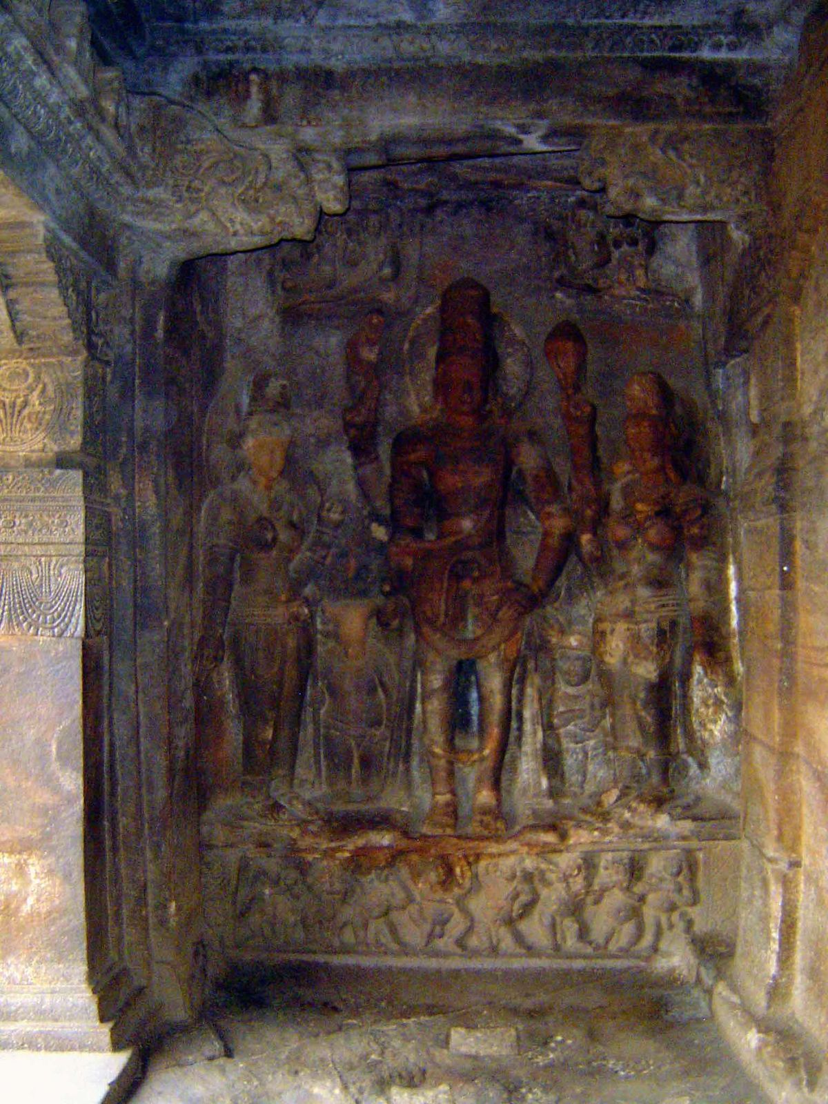 Harihara: a combined figure, half Vishnu and half Shiva. Nandi is next to the Shiva half; a cross-armed Guruda is next to the Vishnu half. T