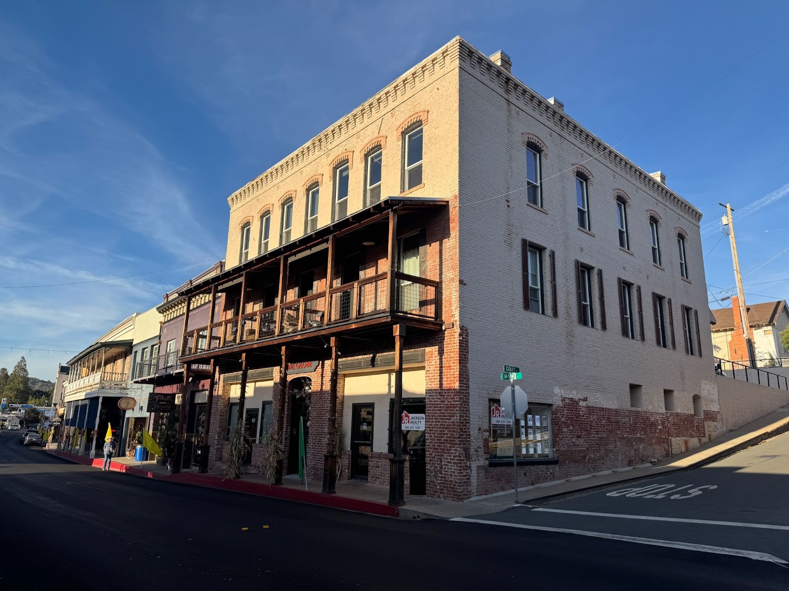It was the Globe Hotel.  It's no longer a hotel, and it has lost its third story balcony.