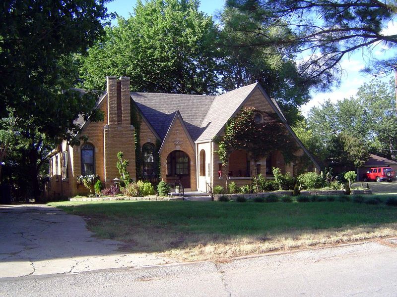 Here, at 2005 NW 22nd, is a brick home from 1926. The half-timbering is gone, but we still have the oversteepened gables that suggest Thomas