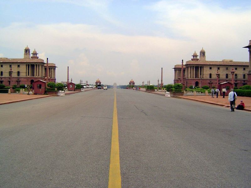 The view from the entrance of Rashtrapati Bhavan back down Kingsway, now Rajpath, with the war-memorial India Gate in the distance. The pair