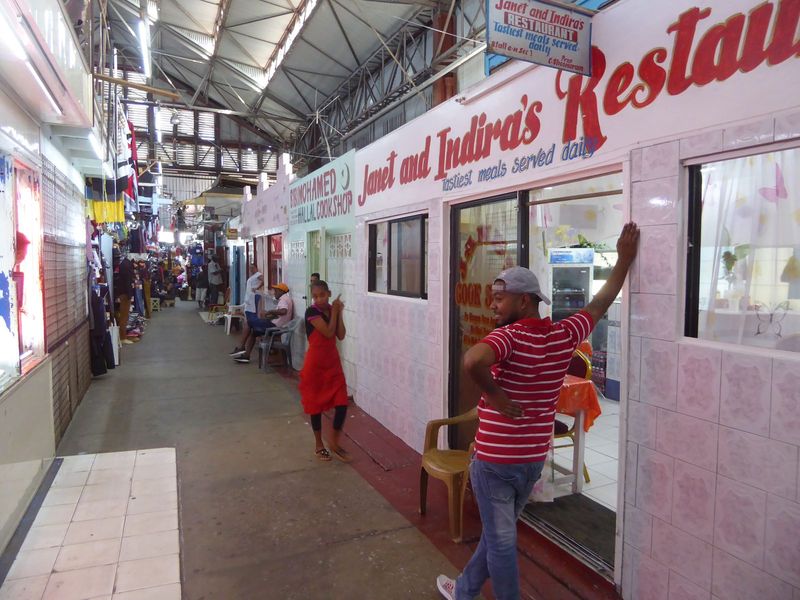 Small sit-down restaurants line one wall.