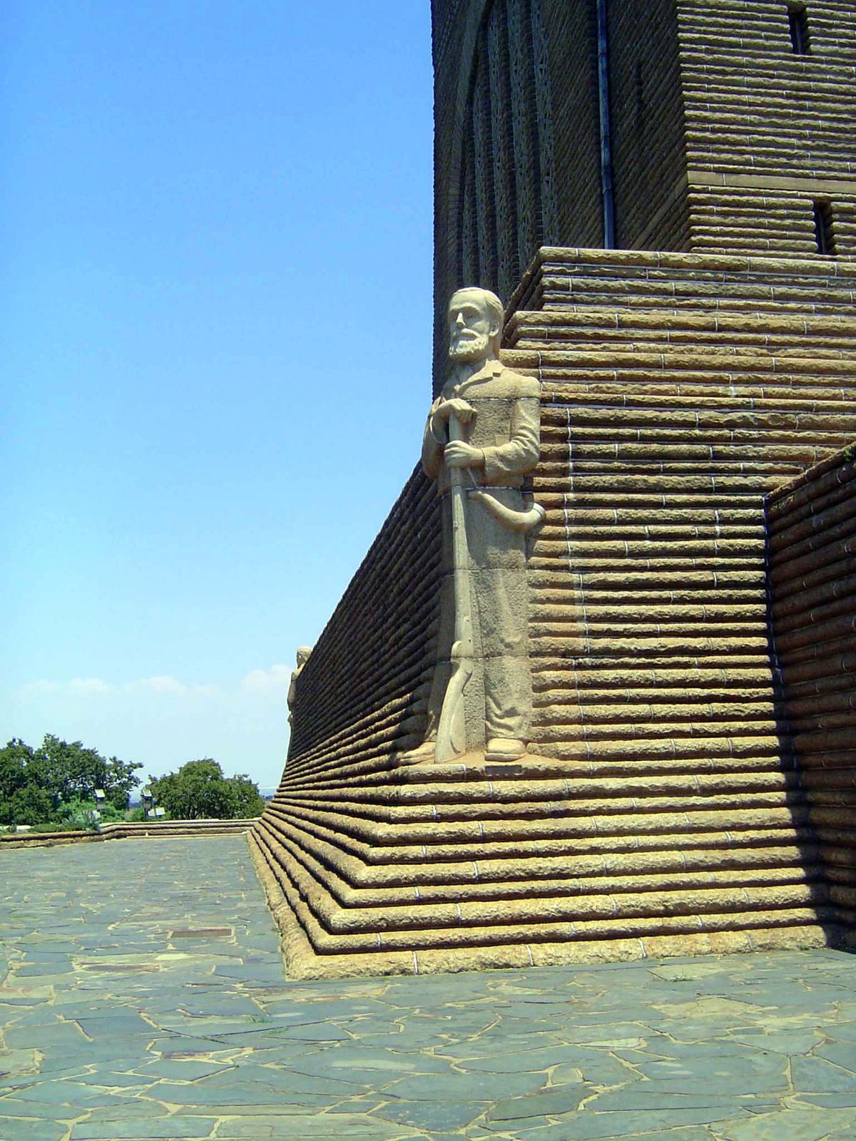 Figures at the corners of the monuments include this one of a marionettish Piet Retief, massacred by the Zulus under Dingane in 1838 and ave