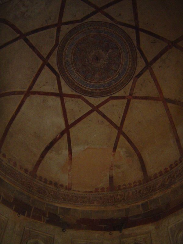 The band at the base of the dome carries a list of the 99 names or attributes of God, while the floral disc above carries perhaps the best k