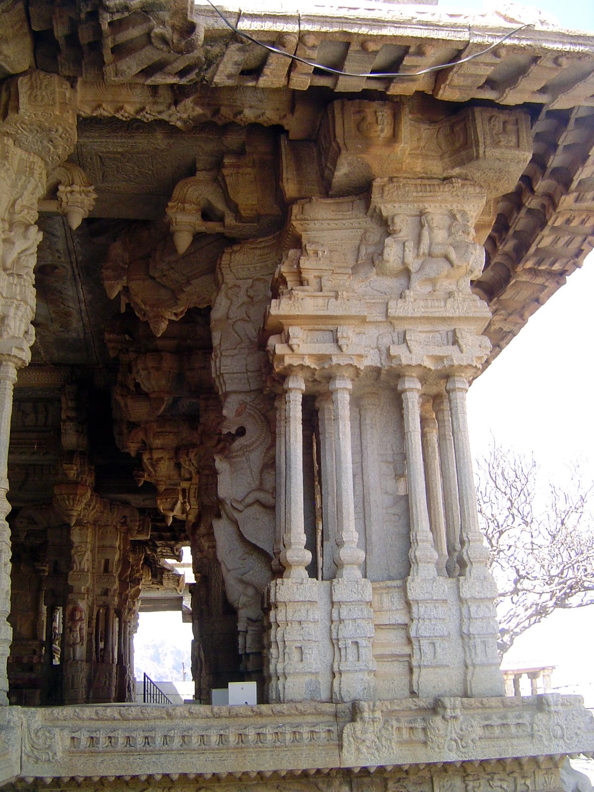 A closer look. The stone brackets that support the dripstone are purely ornamental and a reminder of the wood form that inspired the eaves.