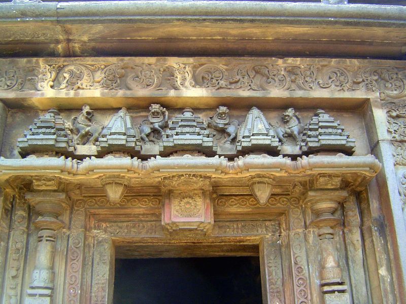 Entrance at the north side, with lions between pyramidal towers.