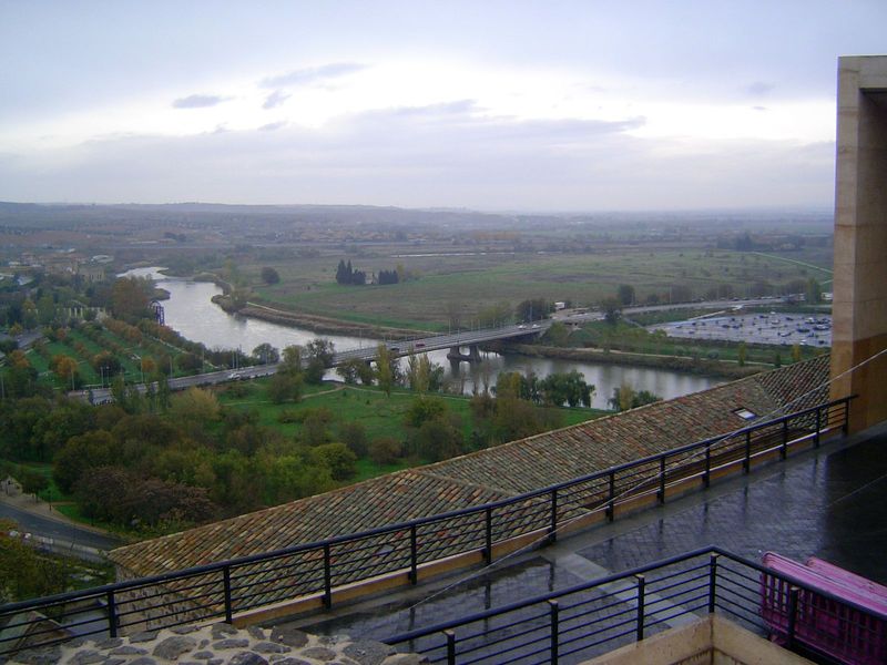A more tranquil view of the river from the northeast corner of the city. On the near-side bank of the river in the distance is a modern wate