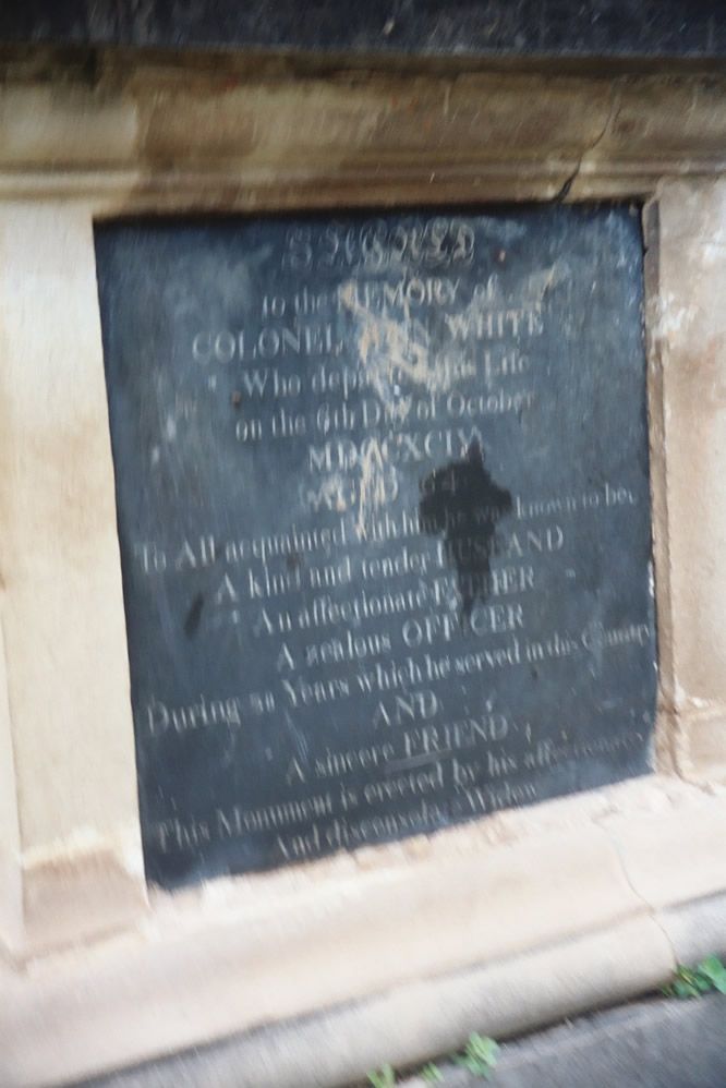 The tombstone of Col. John White, who died in 1794 at age 64. The inscription states that he "was known to be a kind and tender husband, an 