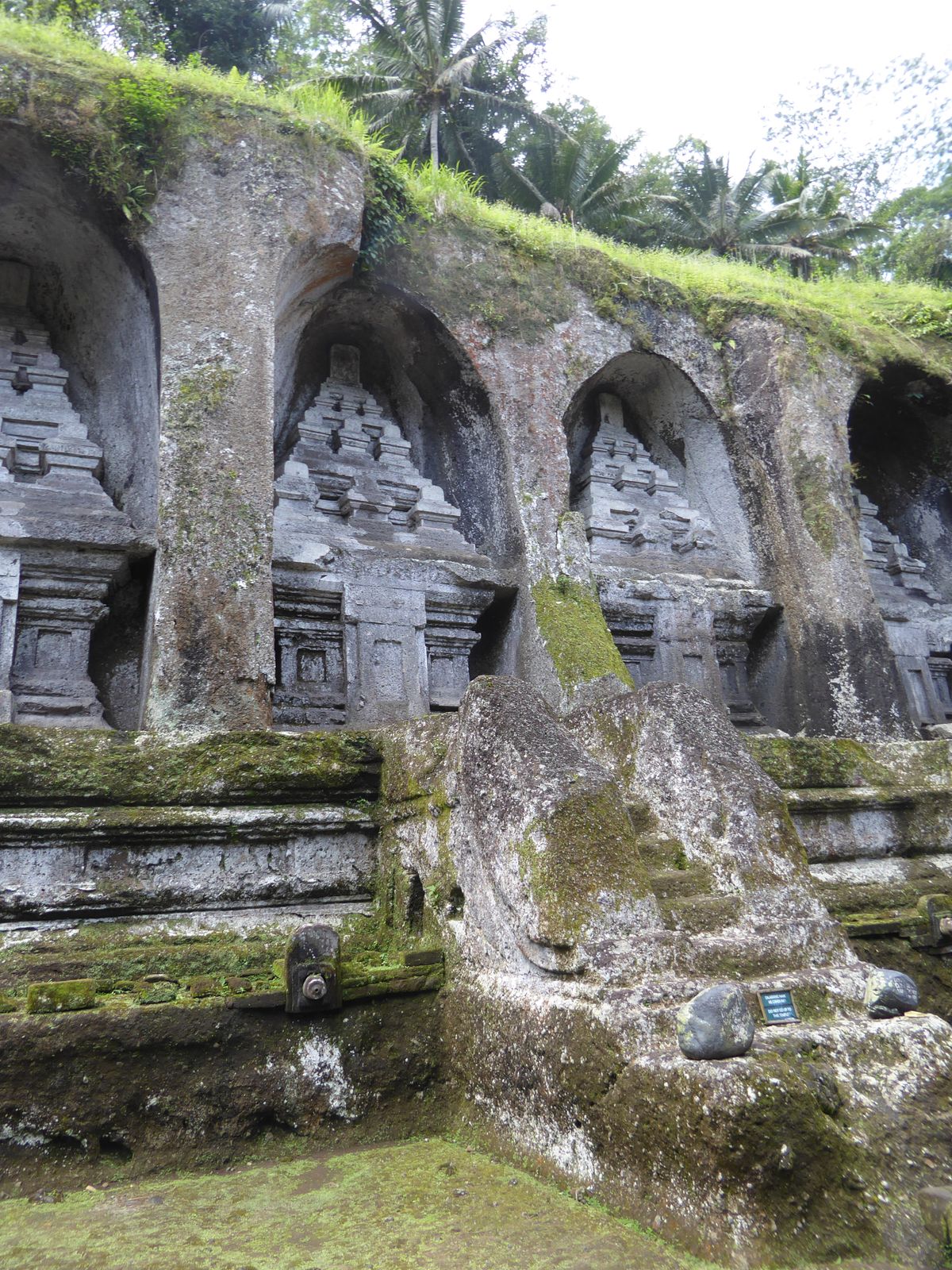 The name of the tombs is cryptic: it's Pura Gunung Kawi, "Temple of the Mountain of the Poet." The stacked forms in each temple are stylized