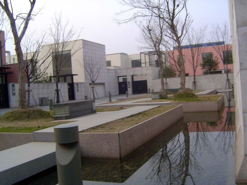 Water moving slowly between houses.