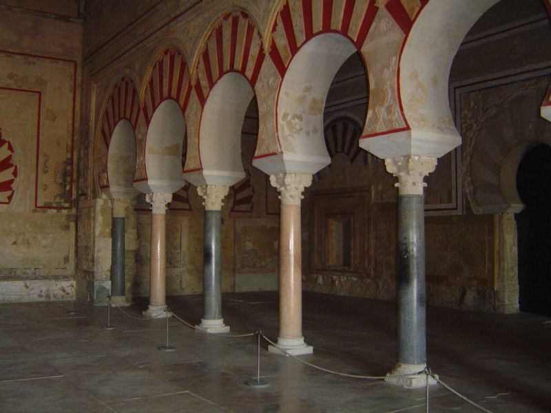 Two arcades divide the room into three sections. The columns were presumably taken from Roman buildings.