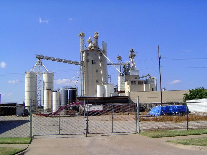 If we jump west, across the site of the former downtown rail yards, we'll find some old Purina elevators. They were built by the Oklahoma Ci