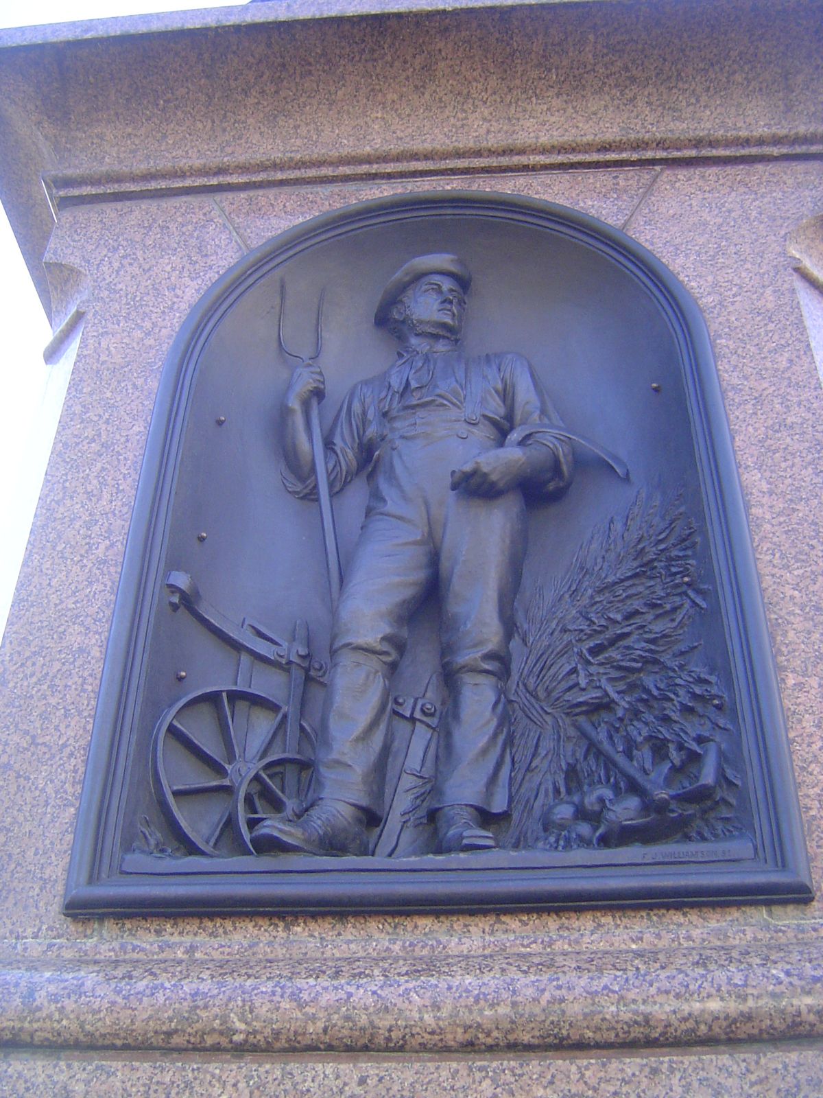 The figures on the base of the statue of Victoria include representations of the Canterbury settlers.