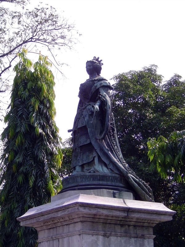In front of the gate is a worn statue of Isabella. She became queen in 1833 but was deposed in 1868. She spent the next 36 years, until her 