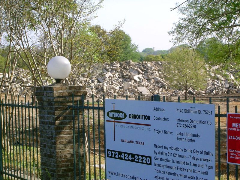The sign promises yet another town center. To accommodate the builders here, DART has amended its plans to include a Lake Highlands Station.