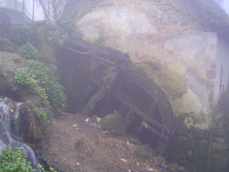 Outside the house, there's a waterwheel and, inside the building, a rice mill.