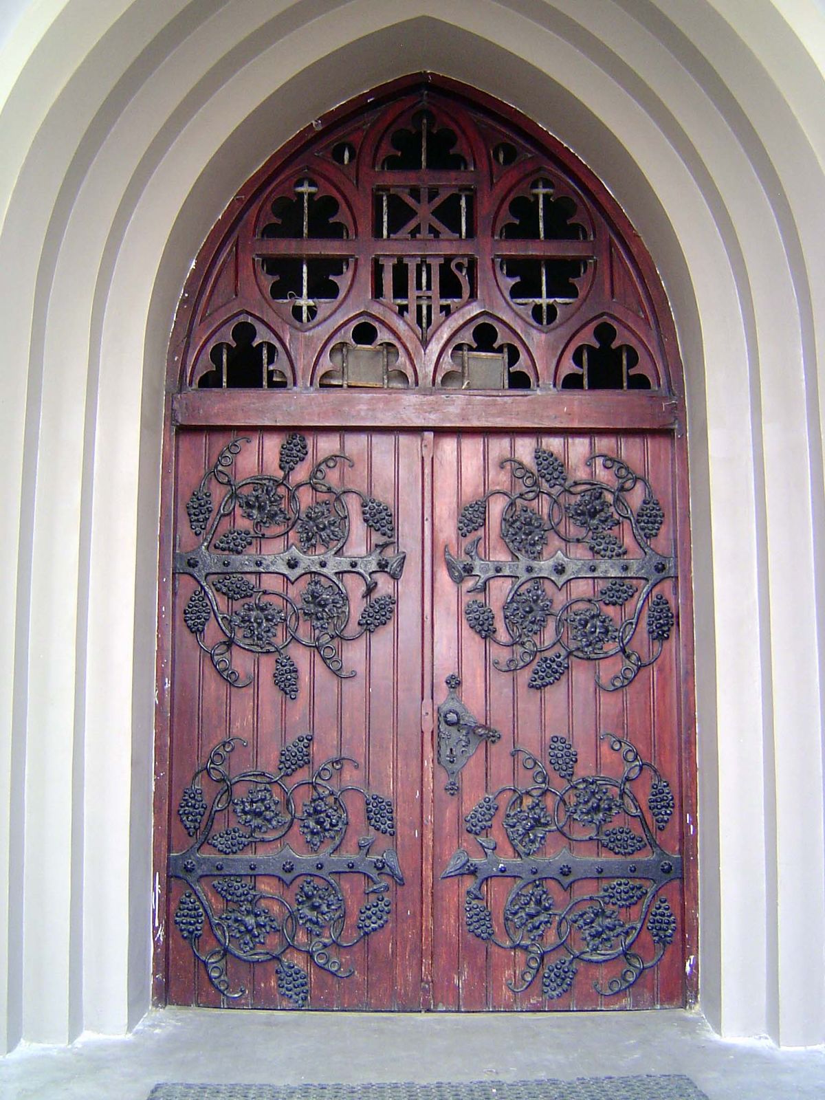 Latin inscriptions are almost hidden on the hinges.