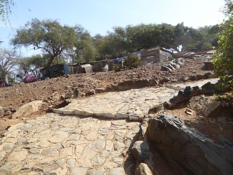 Path up, with squatter huts.