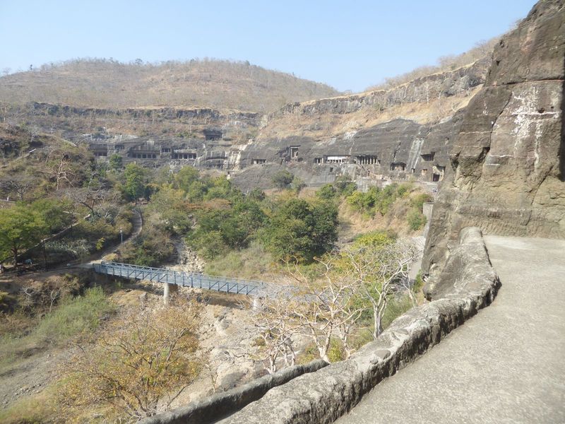 Most people come this way, past the door behind us and then along this concrete highway over as far as Cave 26, where there's a guard itchin