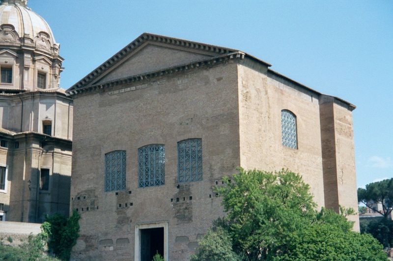 The Curia originally had a portico, and the whole structure was covered with marble, or at least a faux-marble stucco. Its bronze doors now 