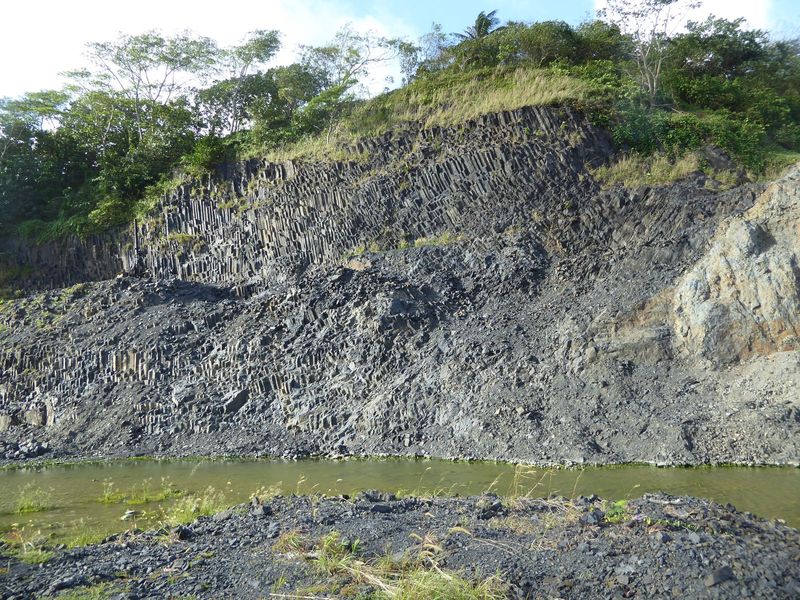 Here's a quarry at the north end of Sokehs Island. See the columnar jointing, which makes it look as though you could pluck logs from the cl