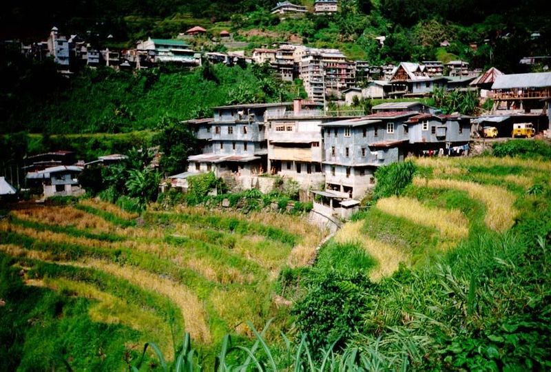 The buildings cluster around a bit of flat land occupied by many shops catering to tourists who have come to see the terraces.