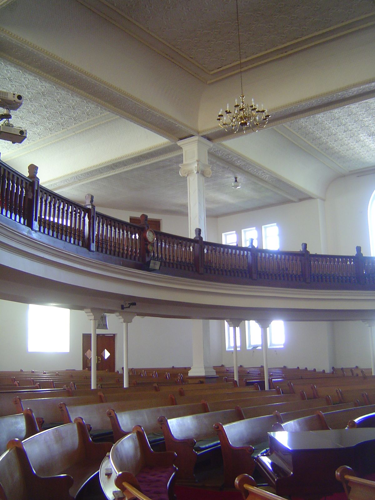 The interior is a square with elegantly curved pews. Getting inside seems to require the equivalent of an act of congress.